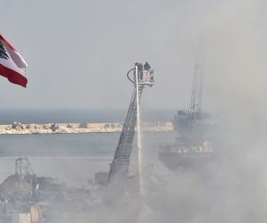 epa08660923 Firefighters extinguish a fire in a warehouse at the port of Beirut, Lebanon, 11 September 2020. A fire broke out on 10 September in an oils and tires warehouse in the port's duty-free zone, just weeks after the 04 August Beirut port blast in which at least 190 people died, more than 6,000 were injured, and the port area and large parts of the city were devastated. According to reports, the fire is brought under control.  EPA/WAEL HAMZEH