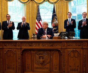 epa08662333 Cabinet members and Foreign Service Officers applaud after US President Donald J. Trump's (C) announcement that Bahrain would normalize relations with Israel, in the Oval Office at the White House in Washington DC, USA, on 11 September 2020.  EPA/Anna Moneymaker / POOL