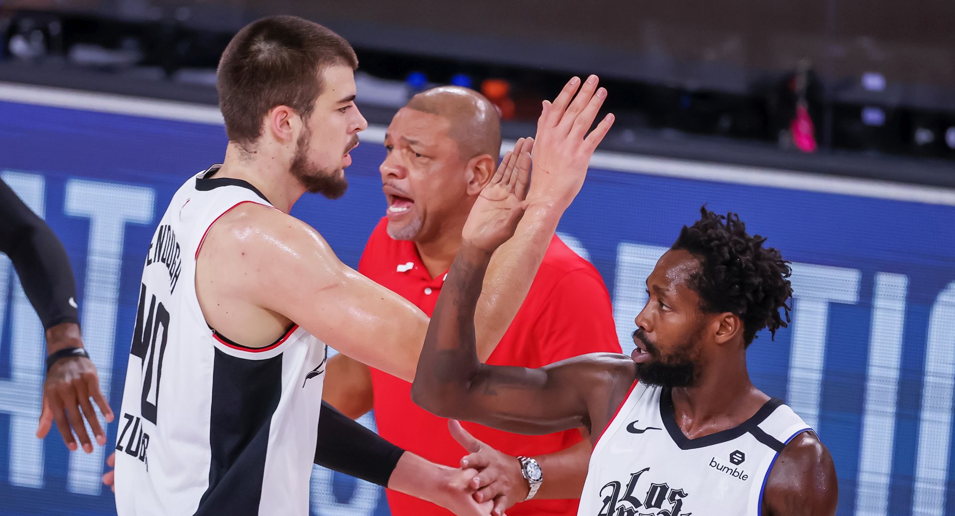 epa08666966 Los Angeles Clippers head coach Doc Rivers (C) reacts with Los Angeles Clippers center Ivica Zubac of Croatia (L) and Los Angeles Clippers guard Patrick Beverley (R) during the first half of the NBA basketball semifinal Western Conference playoff game SIX between the Los Angeles Clippers and the Denver Nuggets at the ESPN Wide World of Sports Complex in Kissimmee, Florida, USA, 13 September 2020.  EPA/ERIK S. LESSER  SHUTTERSTOCK OUT