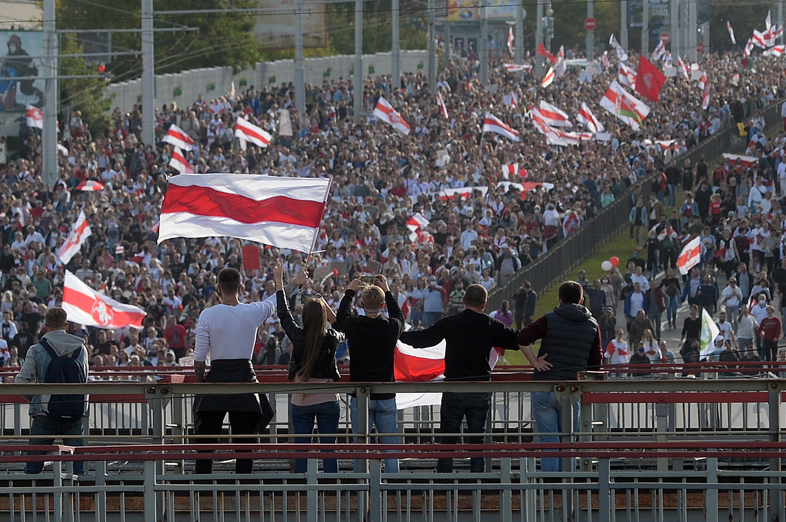 epa08666930 Protesters march during a rally to protest against the presidential election results in Minsk, Belarus, 13 September 2020. Opposition activists continue their every day protest actions, demanding new elections under international observation.  EPA/STRINGER