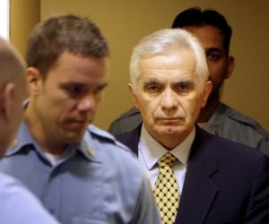 epa08669665 (FILE) - The former speaker of the Bosnian Serb parliament Momcilo Krajisnik (R) enters the courtroom for his appeals verdict at the courtroom of the U.N. Yugoslav war crimes tribunal in the Hague, Netherlands, 17 March 2009 (reissued 15 September 2020). University Clinical Centre in Banja Luka, Bosnia Herzegovina said 15 September 2020 Momcilo Krajisnik, a Bosnian Serb political leader, has died of infection with the novel coronavirus at the clinic in Banja Luka, Bosnia Herzegovina. Krajisnik was found guilty in 2006 of committing crimes against humanity during the Bosnian War by the International Criminal Tribunal for the former Yugoslavia (ICTY) and was sentenced to 20 years' imprisonment. He was 01 September 2013  granted early release after serving two thirds of the sentence.  EPA/BAS CZERWINSKI / POOL