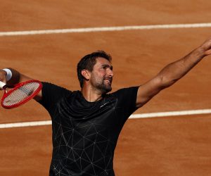 epa08672303 Marin Cilic of Croatia serves in his second round match against David Goffin of Belgium at the Italian Open in Rome, Italy, 16 September 2020.  EPA/Clive Brunskill / POOL
