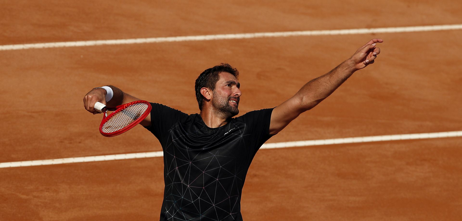 epa08672303 Marin Cilic of Croatia serves in his second round match against David Goffin of Belgium at the Italian Open in Rome, Italy, 16 September 2020.  EPA/Clive Brunskill / POOL