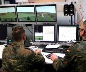 epa08672627 German soldiers monitor the exercise in the control room during the media presentation of the British-German Military Cooperation at the British Simulation Centre in Paderborn, Germany, 16 September 2020. The German Army Tank Battalion 203 from Augustdorf has been training in the simulation centre of the British Army since the beginning of September. The training weeks focus on the use of a tank platoon for combat reconnaissance.  EPA/FRIEDEMANN VOGEL