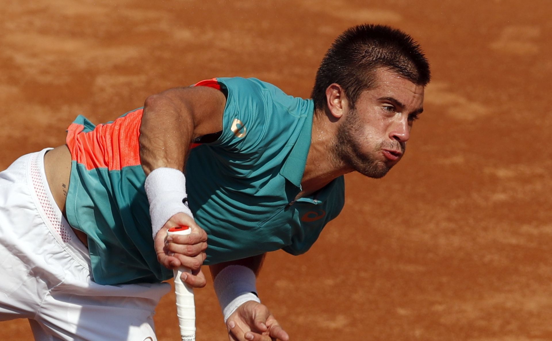 epa08672758 Borna Coric of Croatia in action during his second round match against Stefano Travaglia of Italy at the Italian Open in Rome, Italy, 16 September 2020.  EPA/Clive Brunskill / POOL