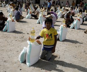epa08688859 Yemenis get emergency food items provided by a local relief group, Mona Relief Yemen, amid aid shortages, in the western province of Hajjah, Yemen, 08 September 2020 (Issued 22 September 2020). According to reports, the United Nations ranks Yemen as the worst humanitarian crisis in the world due to more than five years of conflict which shattered the country’s economy and public services, leaving nearly 80 percent of its 29 million population reliant on food aid, the majority of whom live in the Houthis-controlled north.  EPA/YAHYA ARHAB