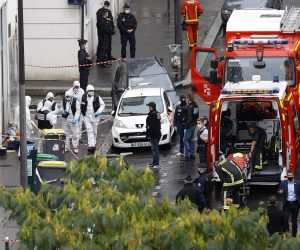epa08696582 French police investigators work on the site of the knife attack near the former Charlie Hebdo offices, in Paris, France, 25 September 2020, after two people have been wounded. According to recent reports, two assailants have been arrested in the Bastille area.  EPA/IAN LANGSDON