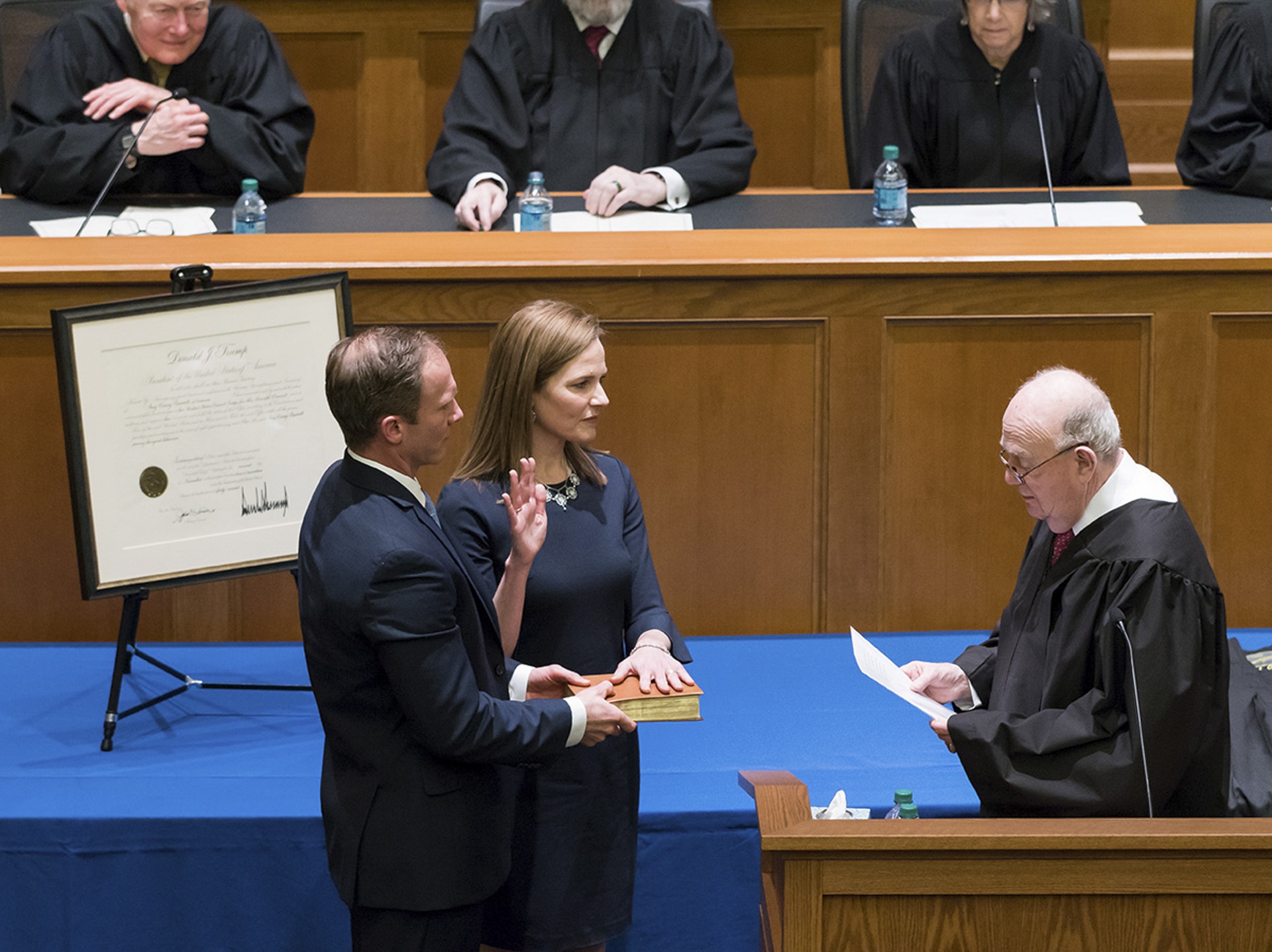 epa08692241 A handout photo provided by the University of Notre Dame Law School shows potential US Supreme Court nominee and current US Court of Appeals for the Seventh Circuit Judge Amy Coney Barrett (2-L) during her investiture as judge for the US Court of Appeals for the Seventh Circuit in the Patrick F. McCartan Courtroom at Notre Dame Law School in South Bend, Indiana, USA, in February 2018 (issued 23 September 2020). US President Donald J. Trump will announce his choice for the replacement for Justice Ruth Bader Ginsburg at the White House in Washington, DC on 26 September 2020. According to media reports Judge Amy Coney Barrett has emerged as US President Trump's favorite.  EPA/UNIVERSITY OF NOTRE DAME LAW SCHOOL / HANDOUT  HANDOUT EDITORIAL USE ONLY/NO SALES