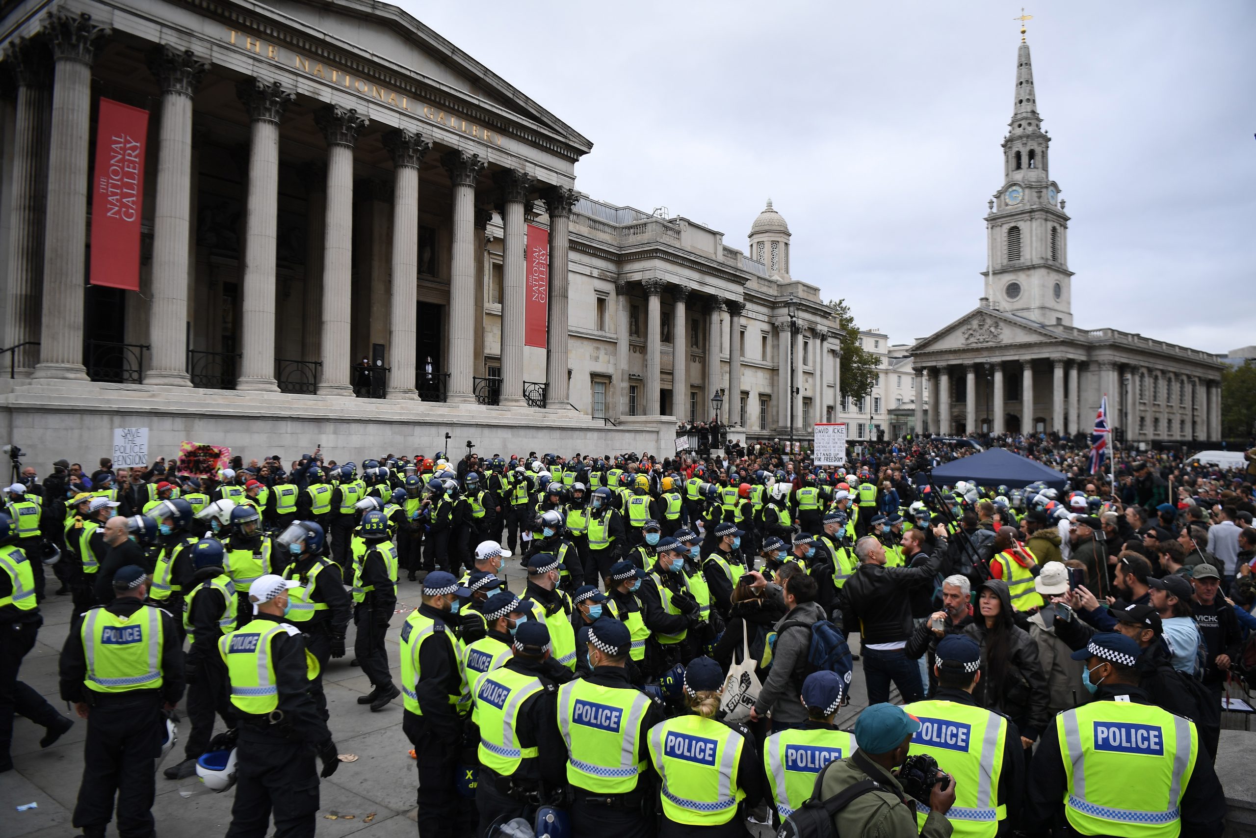 epa08699215 Police clash with protesters during a 'We Do Not Consent' rally at Trafalgar Square in London, Britain, 26 September 2020. Thousends of people gathered at a demonstration to protest against new coronavirus restrictions.  EPA/ANDY RAIN