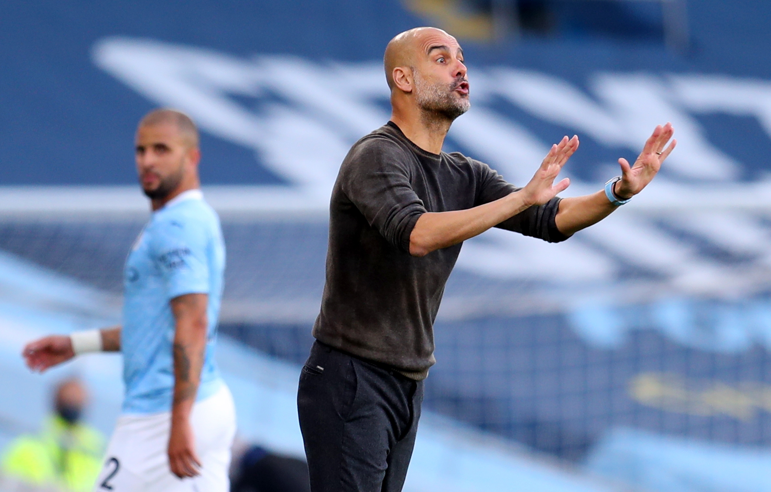 epa08701967 Manchester City manager Pep Guardiola gestures on the touchline during the English Premier League match between Manchester City and Leicester City in Manchester, Britain, 27 September 2020.  EPA/Cath Ivill / POOL EDITORIAL USE ONLY. No use with unauthorized audio, video, data, fixture lists, club/league logos or 'live' services. Online in-match use limited to 120 images, no video emulation. No use in betting, games or single club/league/player publications.