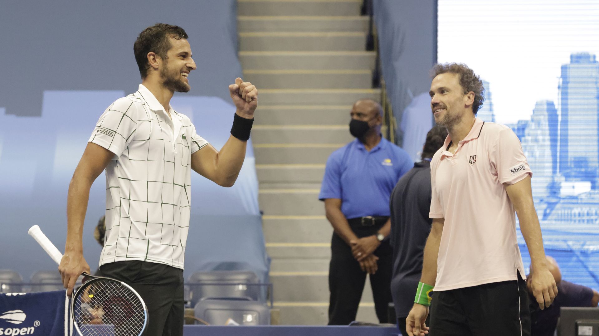 epa08660030 Mate Pavic of Croatia (L) and Bruno Soares of Brazil (R) celebrate after defeating Wesley Koolhof of the Netherlands and Nikola Mektic of Croatia in the men's doubles final match on the eleventh day of the US Open Tennis Championships the USTA National Tennis Center in Flushing Meadows, New York, USA, 10 September 2020. Due to the coronavirus pandemic, the US Open is being played without fans and runs from 31 August through 13 September.  EPA/JASON SZENES