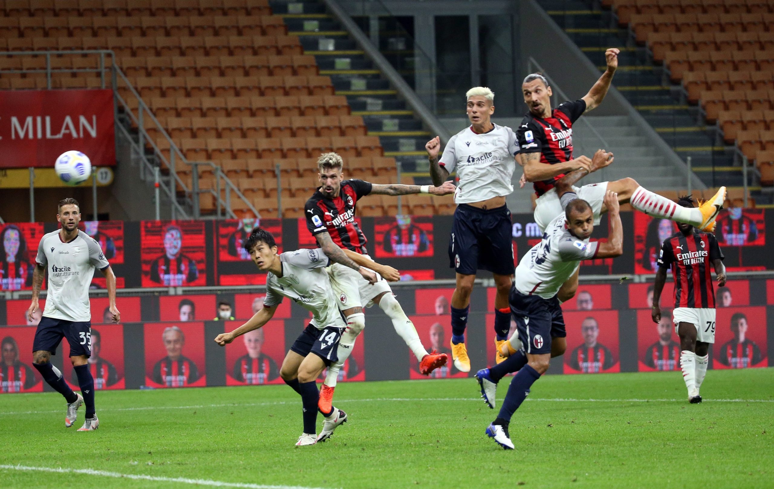 epa08687148 AC Milan's Zlatan Ibrahimovic  (R) scores the 1-0 during the Italian Serie A soccer match Ac Milan vs Fc Bologna at Giuseppe Meazza stadium in Milan, Italy, 21 September  2020.  EPA/MATTEO BAZZI
