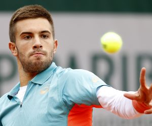 epa08701434 Borna Coric of Croatia in action against Norbert Gombos of Slovakia during their men’s first round match during the French Open tennis tournament at Roland Garros in Paris, France, 27 September 2020.  EPA/IAN LANGSDON