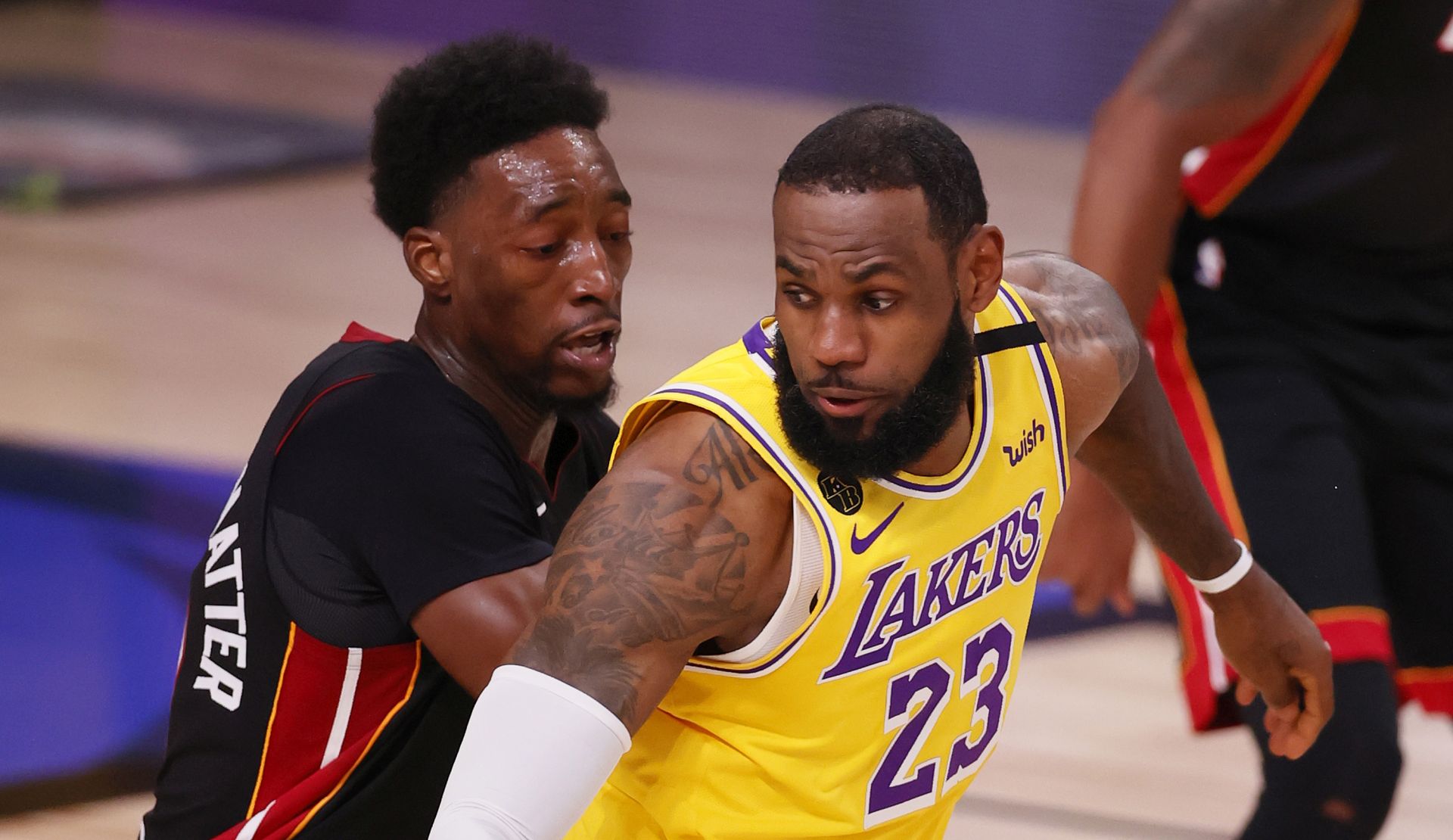 epa08710695 Los Angeles Lakers forward LeBron James (R) is guarded by Miami Heat forward Bam Adebayo (L) in the first half of their NBA Finals basketball game one at the ESPN Wide World of Sports Complex in Kissimmee, Florida, USA, 30 September 2020.  EPA/ERIK S. LESSER  SHUTTERSTOCK OUT