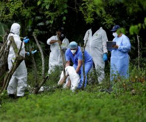 epa08714218 Forensics and police investigators work at the scene where the bodies of five people who were killed were found in San Julian, El Salvador, 01 October 2020. At least five people were killed in a village in the municipality of San Julian, in western El Salvador, the Attorney General's Office (FGR) reported on 01 October. According to the Prosecutor's Office, which shared information provided by the National Civil Police (PNC) in the place, the 'deprivation of liberty' of three people was reported on 30 September and now 'the notice of some deceased persons was received' in the Guacoco village.  EPA/Rodrigo Sura ATTENTION: GRAPHIC CONTENT  EPA-EFE/Rodrigo Sura ATTENTION: GRAPHIC CONTENT