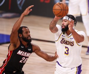 epa08721391 Los Angeles Lakers forward Anthony Davis (R) passes the ball in front of Andre Iguodala (L) in the third quarter of their NBA Finals basketball game three between the Los Angeles Lakers and the Miami Heat at the ESPN Wide World of Sports Complex in Kissimmee, Florida, USA, 04 October 2020.  EPA/ERIK S. LESSER SHUTTERSTOCK OUT