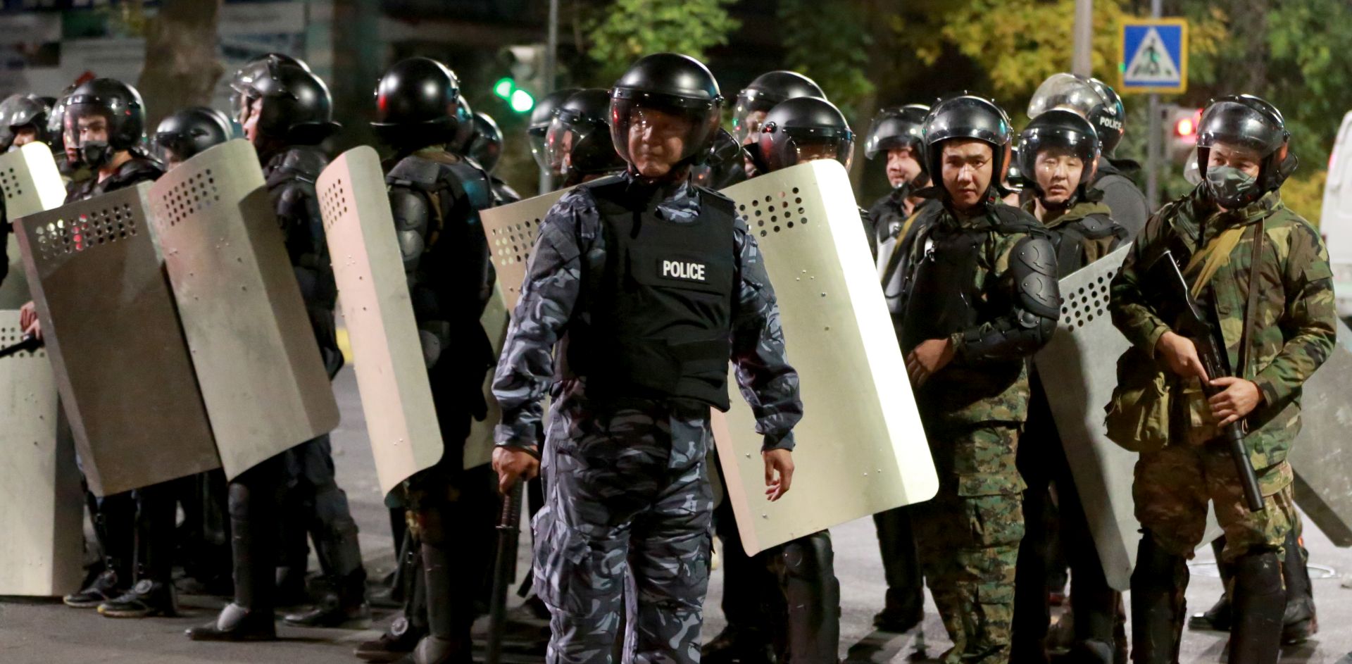 epa08722763 Kyrgyz police prepare to disperse protesters during clashes during opposition protest against the parliamentary election results in central Bishkek, Kyrgyzstan, 05 October 2020. According to reports, thousands of protesters took to the streets protesting against results of parliamentary elections claiming that they were rigged.  EPA/IGOR KOVALENKO