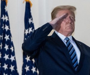 epa08723136 US President Donald J. Trumpsalutes after taking off his mask on returning to the White House, in Washington, DC, USA, 05 October 2020. Trump was returning to the White House following several days at Walter Reed National Military Medical Center for treatment for COVID-19.  EPA/KEN CEDENO / POOL