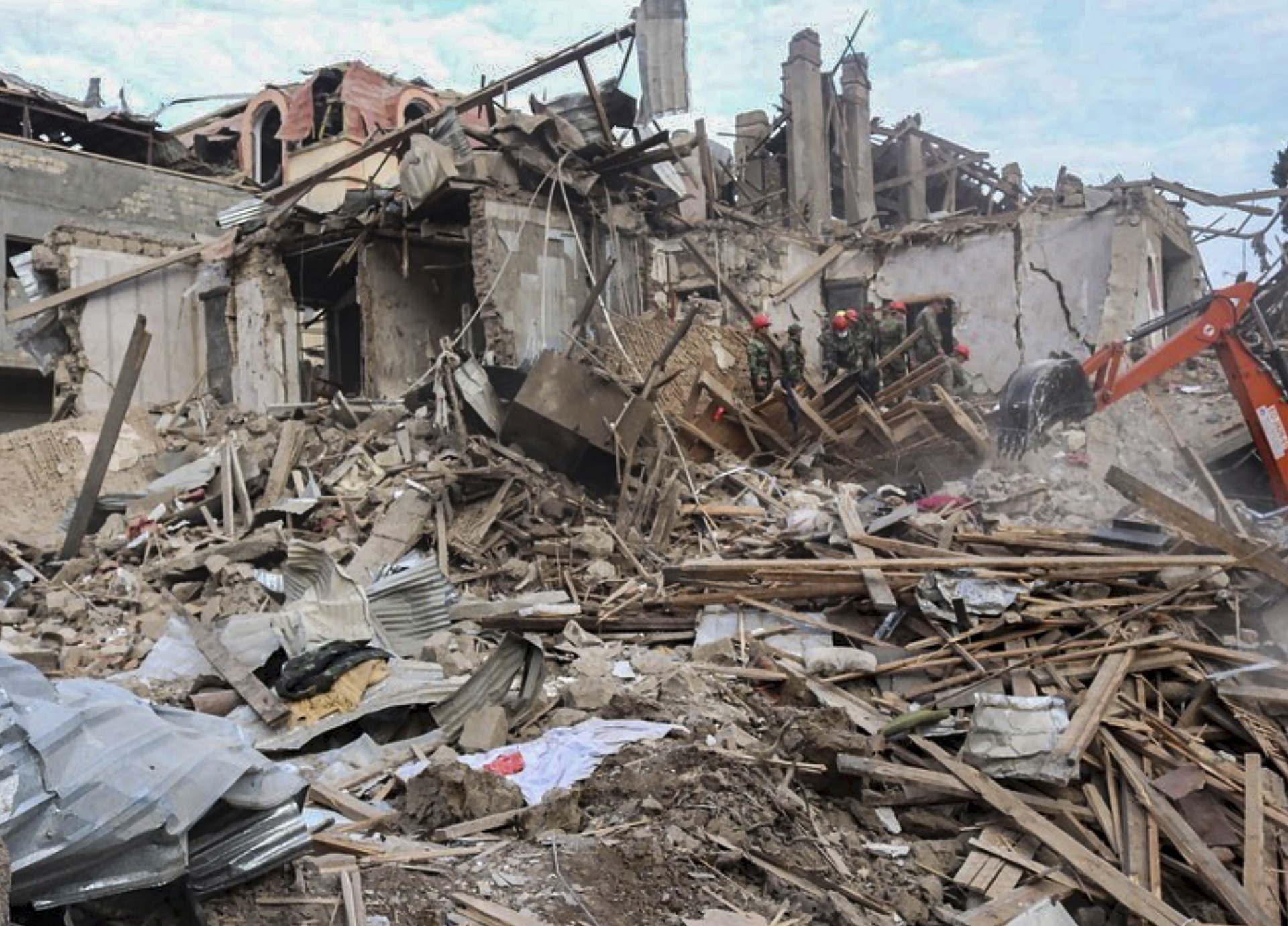 epa08735167 A handout photo made available by the Azerbaijan Foreign Ministry claims to show houses allegedly damaged by an alleged recent shelling in Ganja, Azerbaijan, 11 October 2020. Foreign Ministers of the Republic of Azerbaijan and the Republic of Armenia, with the mediation of the Russian Federation in Moscow, reached an agreement on compliance with the humanitarian ceasefire from 12:00 on 10 October 2020. Armed clashes erupted on 27 September 2020 in the simmering territorial conflict between Azerbaijan and Armenia over the Nagorno-Karabakh territory along the contact line of the self-proclaimed Nagorno-Karabakh Republic (also known as Artsakh).  EPA/AZERBAIJAN FOREIGN MINISTRY PRESS SERVICE HANDOUT HANDOUT MANDATORY CREDIT BEST QUALITY AVAILABLE HANDOUT EDITORIAL USE ONLY/NO SALES