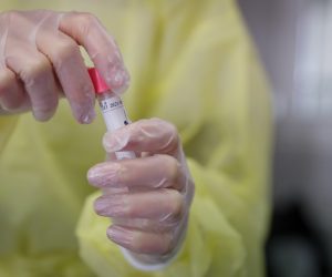 epa08737931 Nurse prepares to perform COVID-19 test on patient at a testing center run by the Belgian Red Cross in Brussels, Belgium, 12 October 2020. The average confirmed COVID-19 cases over the last week are 4.154 cases, making Belgium the second most affected countries in Europe.  EPA/STEPHANIE LECOCQ
