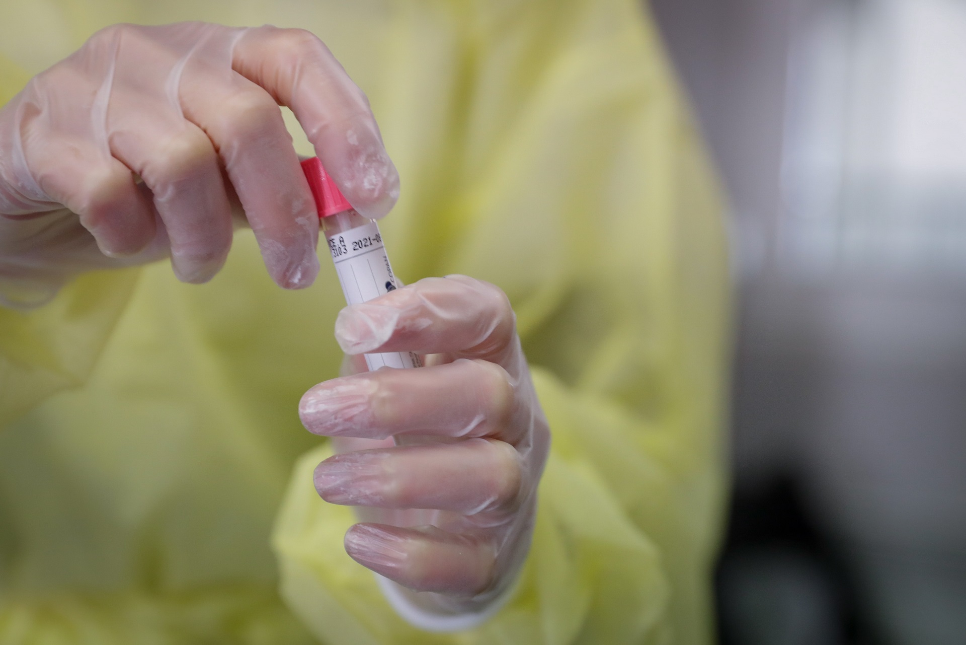 epa08737931 Nurse prepares to perform COVID-19 test on patient at a testing center run by the Belgian Red Cross in Brussels, Belgium, 12 October 2020. The average confirmed COVID-19 cases over the last week are 4.154 cases, making Belgium the second most affected countries in Europe.  EPA/STEPHANIE LECOCQ