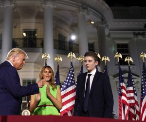epa08745888 (FILE) - First Lady Melania Trump (c) and Barron Trump (R) join the US Presidnet Donald J. Trump (L) on stage at the end of his speech during the closing night of the Republican National Convention, on the South Lawn of the White House, in Washington, DC, USA, 27 August 2020 (reissued 14 October 2020). According to media reports, Barron Trump was tested positive for the coronavirus but has no symptoms, as the First Lady Melania Trump said.  EPA/Erin Scott / POOL