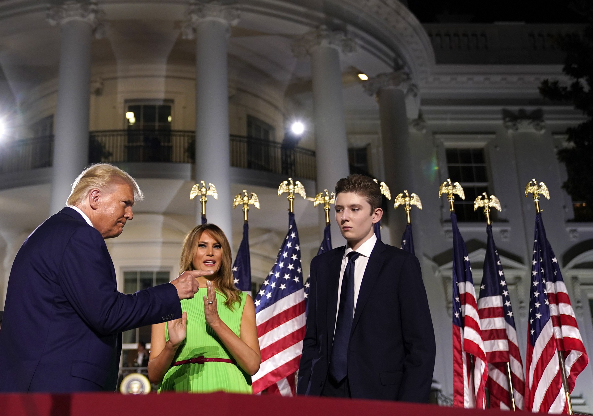 epa08745888 (FILE) - First Lady Melania Trump (c) and Barron Trump (R) join the US Presidnet Donald J. Trump (L) on stage at the end of his speech during the closing night of the Republican National Convention, on the South Lawn of the White House, in Washington, DC, USA, 27 August 2020 (reissued 14 October 2020). According to media reports, Barron Trump was tested positive for the coronavirus but has no symptoms, as the First Lady Melania Trump said.  EPA/Erin Scott / POOL