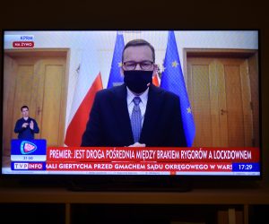 epa08748677 A television screen shows Polish Prime Minister Mateusz Morawiecki during a press conference on the coronavirus pandemic situation in Warsaw, Poland, 15 October 2020.  EPA/Marcin Obara POLAND OUT