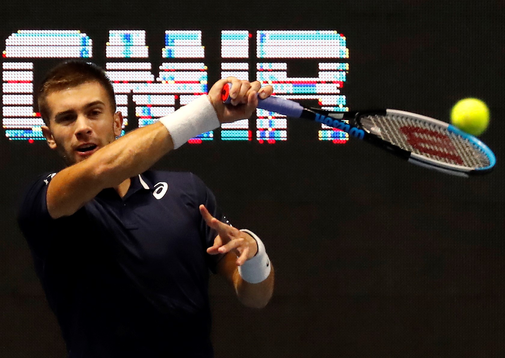 epa08750648 Borna Coric of Croatia in action against Reilly Opelka of the USA during their quarter final match of the St.Petersburg Open ATP tennis tournament in St.Petersburg, Russia, 16 October 2020.  EPA/ANATOLY MALTSEV