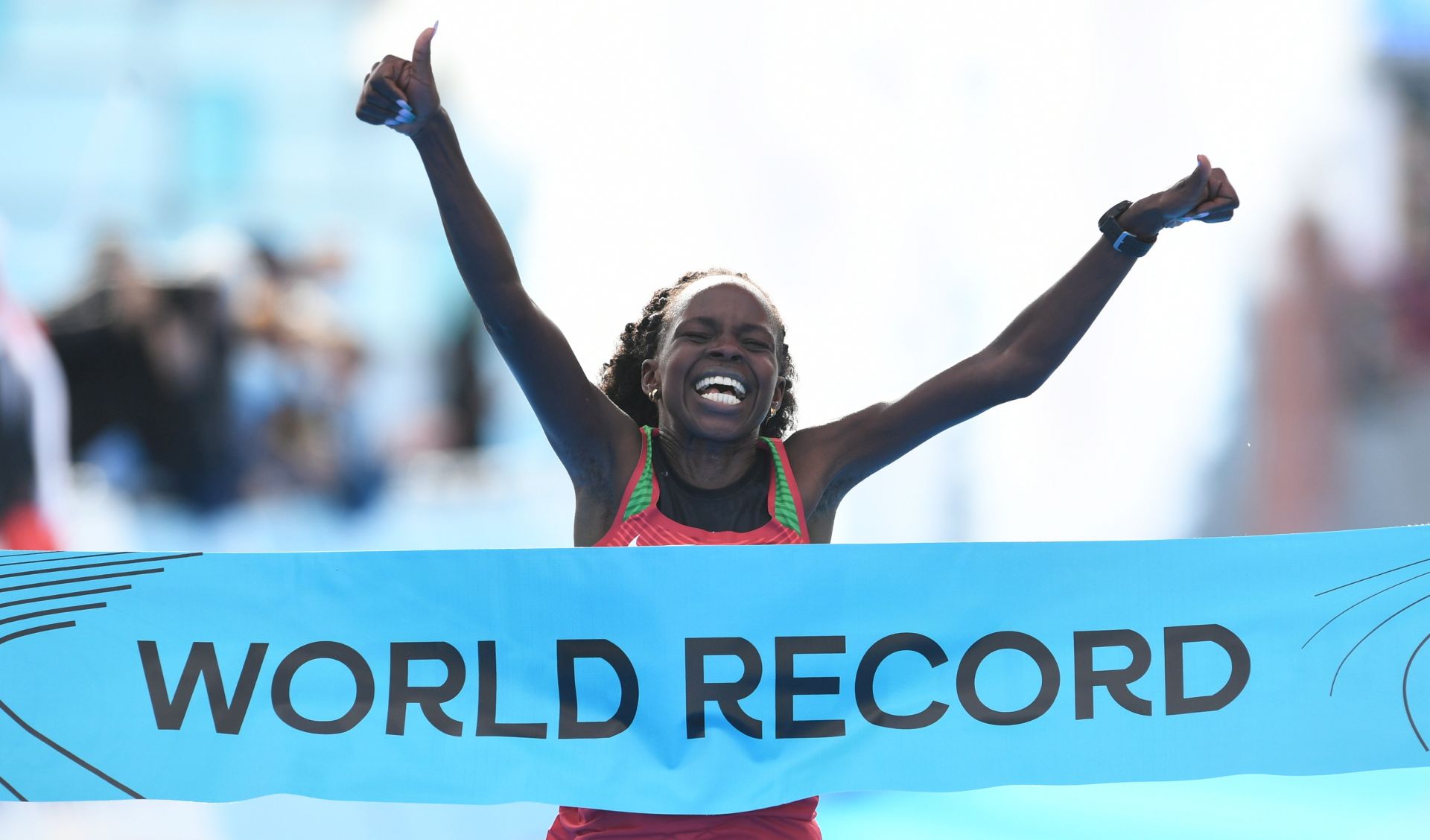 epa08752337 Peres Jepchirchir from Kenya celebrates winning the International Association of Athletics Federations (IAAF) women's World Half Marathon Championships 2020 in Gdynia, northern Poland, 17 October 2020.  Peres Jepchirchir has set women-only world record.  EPA/ADAM WARZAWA POLAND OUT