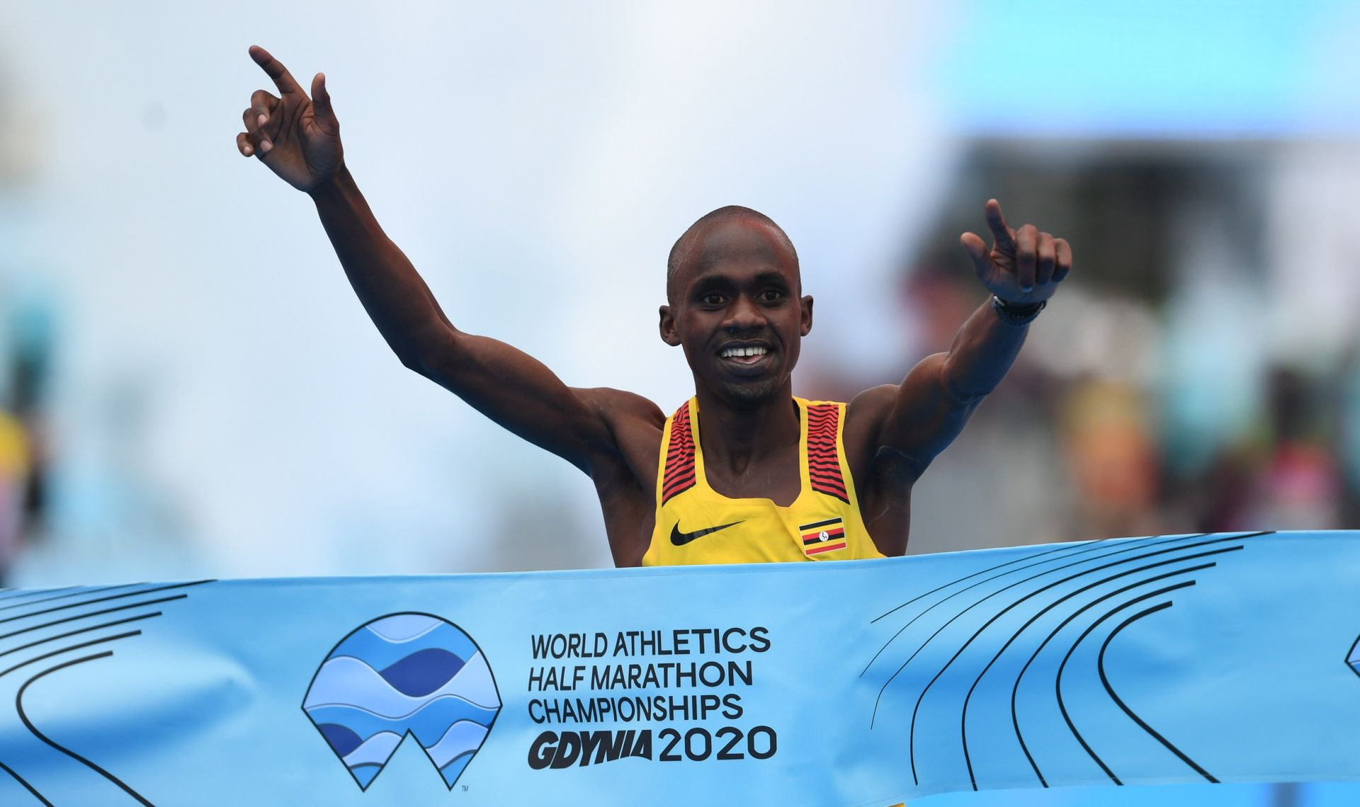 epa08752590 Jacob Kiplimo of Uganda wins the men's race of the International Association of Athletics Federations (IAAF) World Half Marathon Championships 2020 in Gdynia, northern Poland, 17 October 2020.  EPA/ADAM WARZAWA POLAND OUT