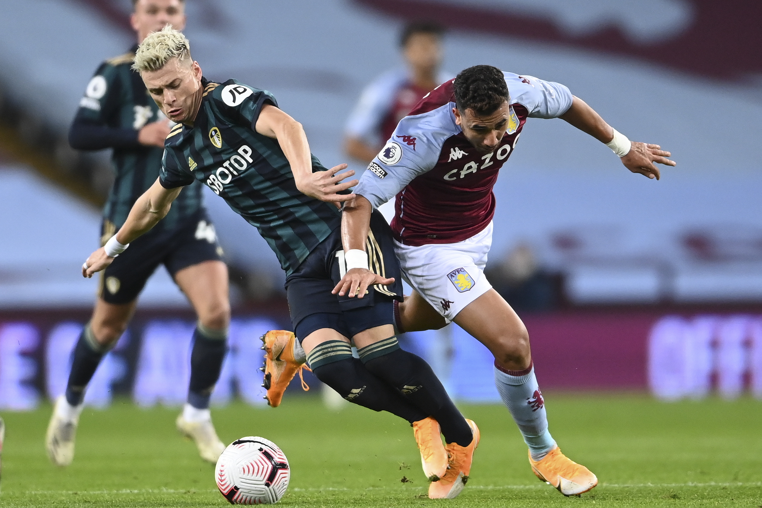 epa08768916 Mahmoud Trezeguet (R) of Aston Villa and Ezgjan Alioski (L) of Leeds United in action during the English Premier League soccer match between Aston Villa and Leeds United in Birmingham, Britain, 23 October 2020.  EPA/Laurence Griffiths / POOL EDITORIAL USE ONLY. No use with unauthorized audio, video, data, fixture lists, club/league logos or 'live' services. Online in-match use limited to 120 images, no video emulation. No use in betting, games or single club/league/player publications.