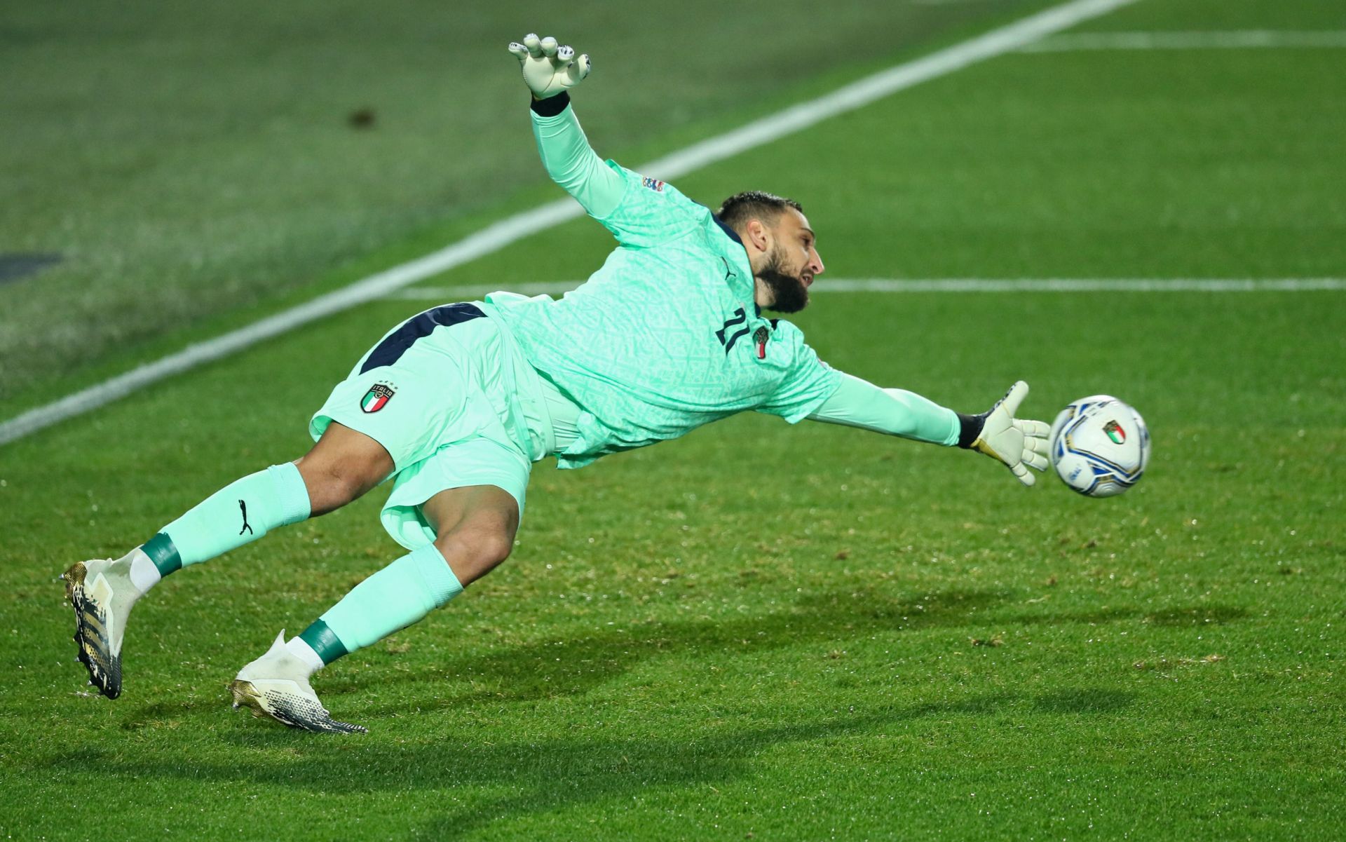 epa08745584 Italy's goalkeeper Gianluigi Donnarumma in action during the UEFA Nations League soccer match between Italy and Netherlands, Bergamo, Italy, 14 October 2020.  EPA/PAOLO MAGNI
