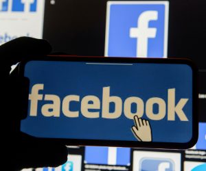 FILE PHOTO: Facebook logos FILE PHOTO: The Facebook logo is displayed on a mobile phone in this picture illustration taken December 2, 2019. REUTERS/Johanna Geron/Illustration/File Photo JOHANNA GERON