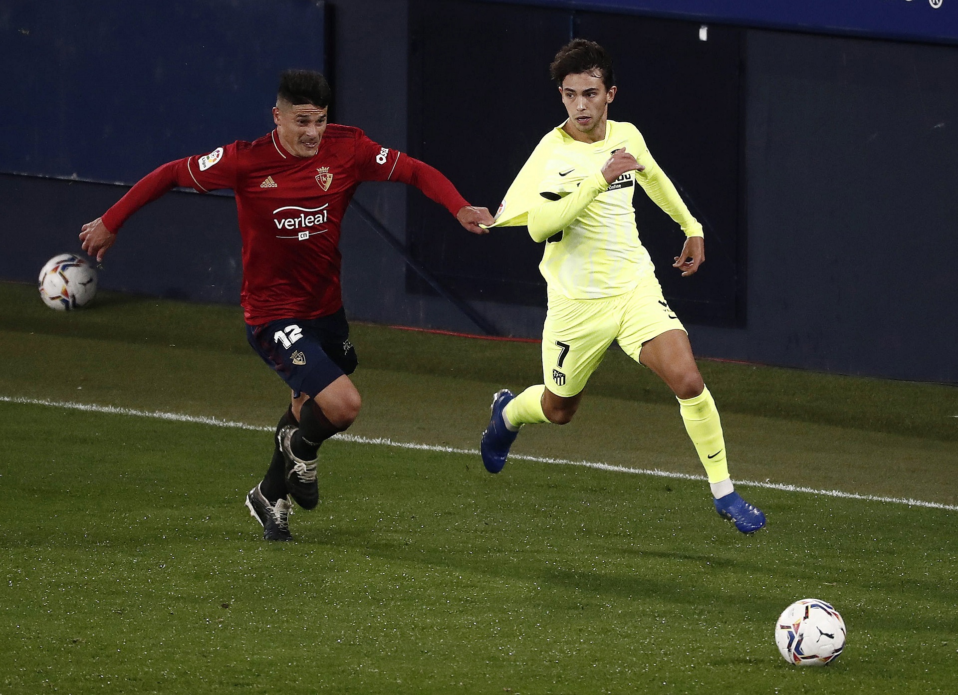 epa08789651 Osasuna's defender Facundo Roncaglia (L) vies for the ball against Atletico's striker Joao Felix during the Spanish LaLiga soccer match between CA Osasuna and Atletico de Madrid at El Sadar stadium in Pamplona, northern Spain, 31 October 2020.  EPA/Jesus Diges