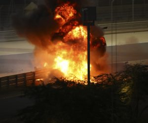 epa08850807 Flames on the crash site of French Formula One driver Romain Grosjean of the Haas F1 Team during the start of the Formula One Grand of Bahrain on the Bahrain International Circuit in Sakhir, Bahrain, 29 November 2020.  EPA/Bryn Lennon / Pool