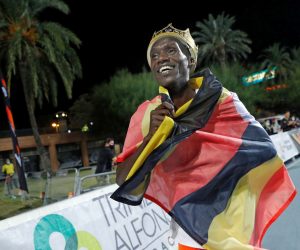 epa08727897 Uganda's Joshua Cheptegei celebrates after setting a new men's 10,000m world record at the NN Valencia World Record Day athletics meeting held at Turia stadium in Valencia, eastern Spain, 07 October 2020.  EPA/Manuel Bruque