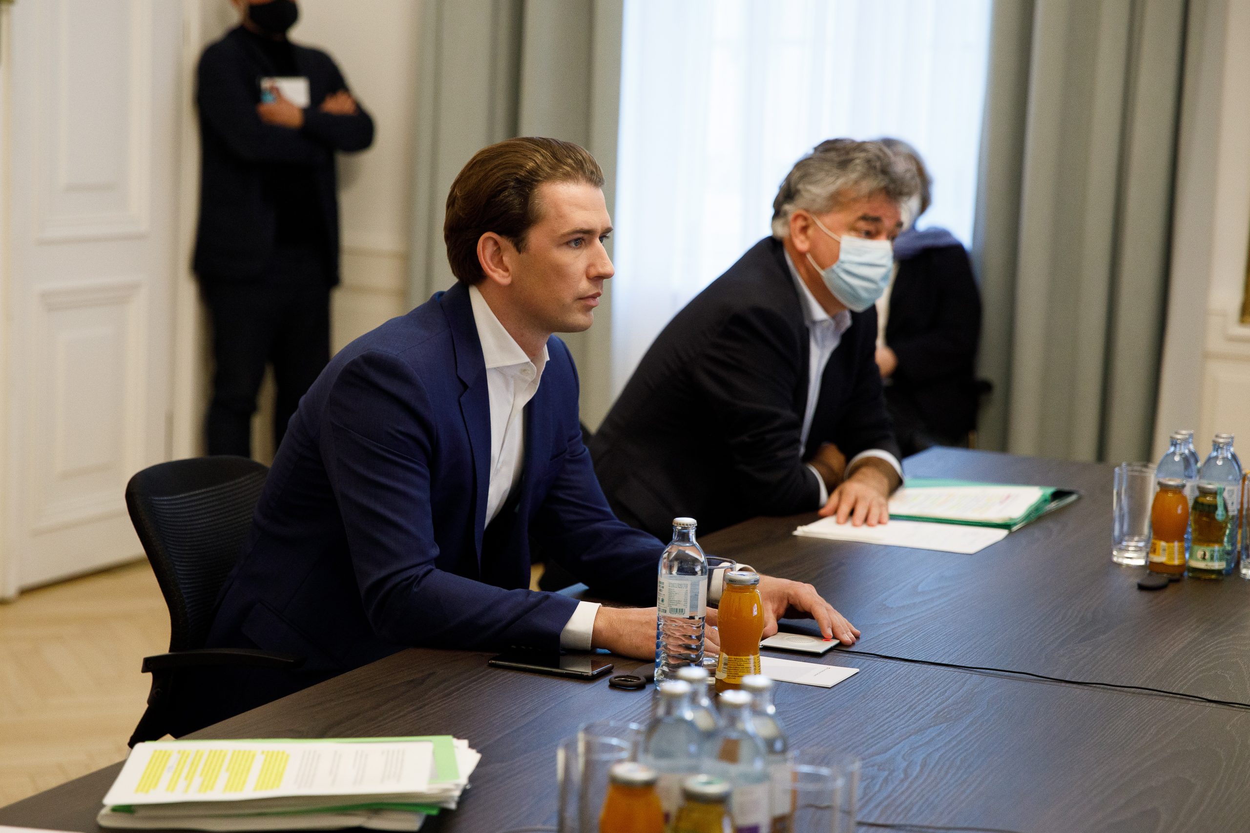 epa08788832 Austrian Chancellor Sebastian Kurz (L) speaks during a video conference next to Austrian Vice-Chancellor Werner Kogler (R) at the Austrian Chancellery in Vienna, Austria, 31 October 2020. Austrian government will introduce further strict measures to slow down the ongoing pandemic of the COVID-19 disease caused by the SARS-CoV-2 coronavirus.  EPA/FLORIAN WIESER