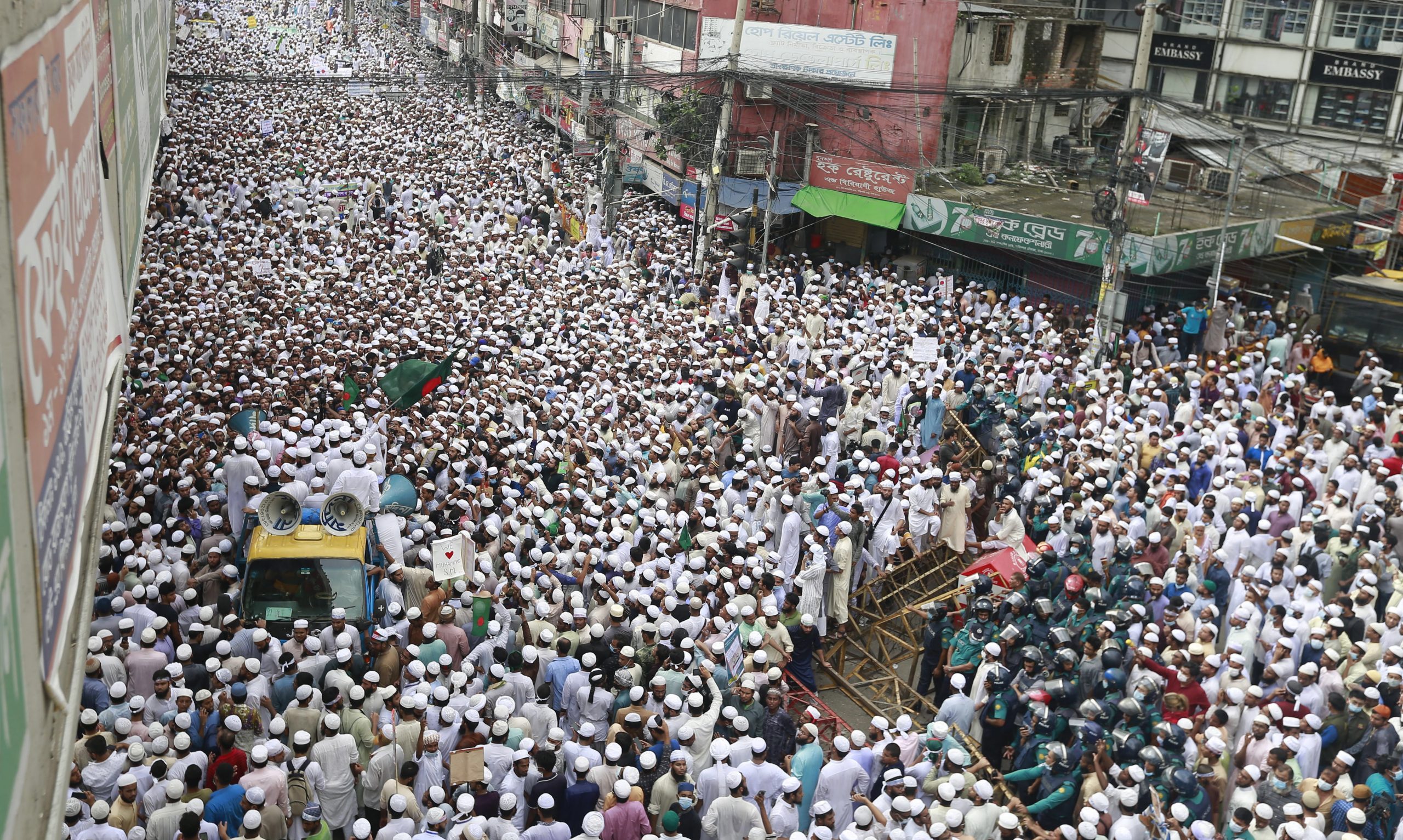 epa08792617 Members of the Hefazat-e-Islam Bangladesh during an anti-France protest at Baitul Mukarram Mosque as they march towards the French Embassy in Dhaka, Bangladesh 02 November 2020.The protest was held following French President Macron's remarks after the beheading of a teacher who had shown cartoons of the Prophet Muhammad to discuss the topic freedom of speech in class in France. Macron vowed his country would not give up publishing such cartoons which sparked protests all across predominantly Muslim countries.  EPA/MONIRUL ALAM