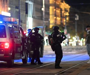 epa08794206 Austrian police special forces search a civilian infront of The Wiener Staatsoper (Vienna State Opera) after a shooting near the Stadttempel' synagogue in Vienna, Austria, 02 November 2020. According to recent reports, at least one person is reported to have died and many are injured in what officials treat as a terror attack.  EPA/CHRISTIAN BRUNA