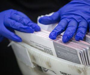 epa08794333 An election worker opens mail-in ballots and checks for irregularities at the Los Angeles County Registrar Recorders' mail-in ballot processing center at the Pomona Fairplex in Pomona, California, USA, 02 November 2020.  EPA/ETIENNE LAURENT