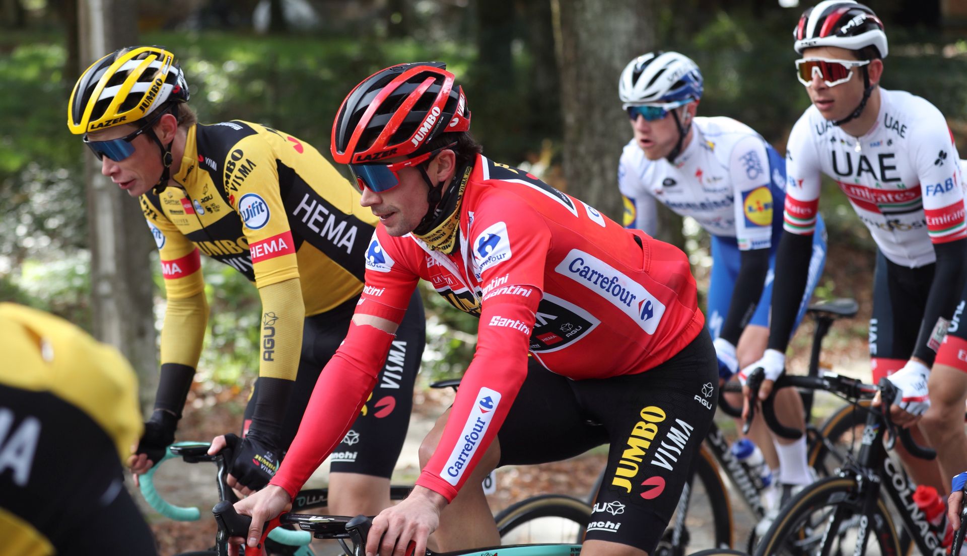 epa08798212 Slovenian rider Primoz Roglic (front) of Jumbo-Visma team in action during the 14th stage of the Vuelta a Espana 2020 cycling race, over 204.7km between Lugo and Ourense, Spain, 04 November 2020.  EPA/KIKO HUESCA