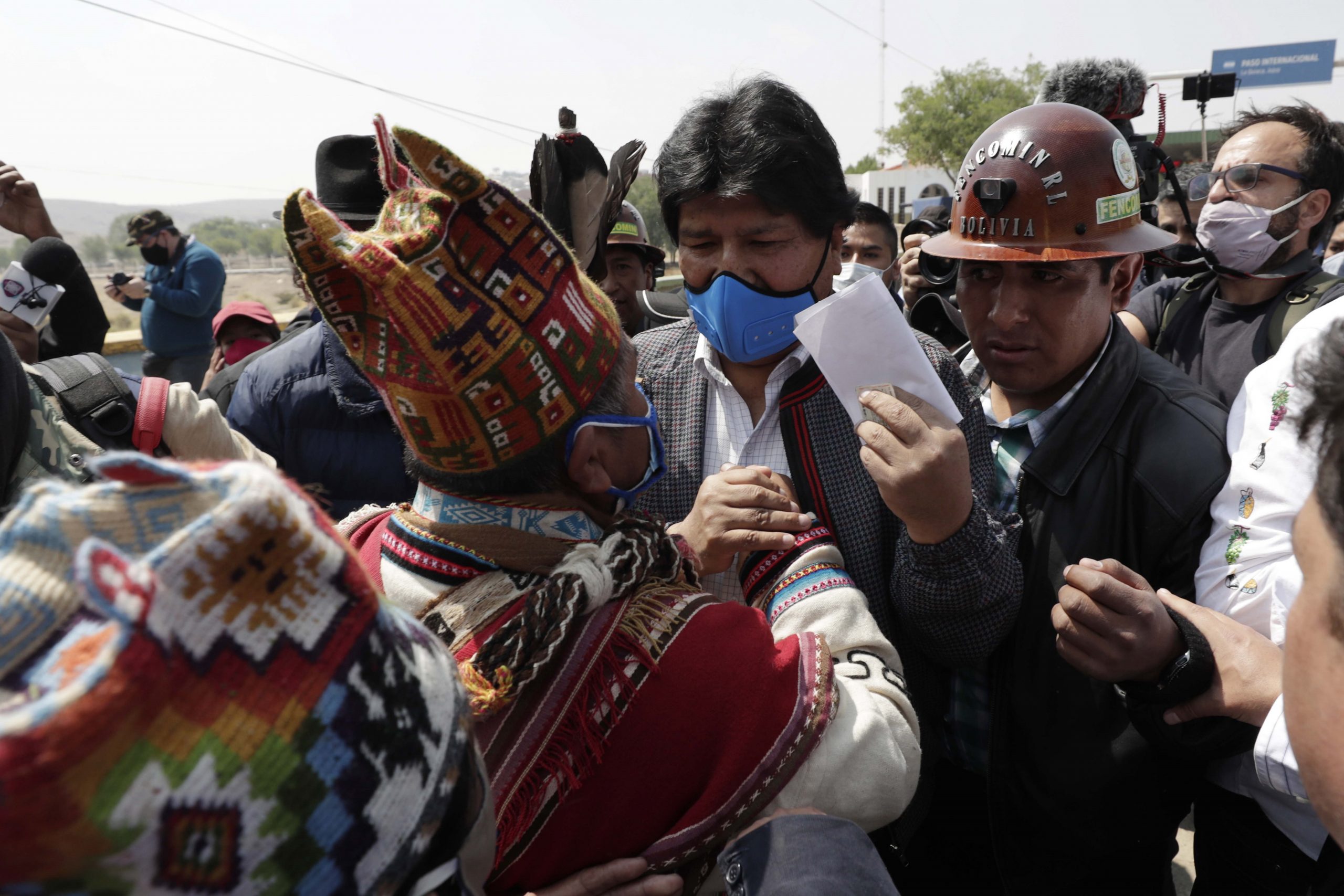 epa08809946 Former President of Bolivia Evo Morales (C) greets his supporters upon his arrival in Villazon, a Bolivian town in the frontier with Argentina, 09 November 2020. After eleven months in Argentina, the former Bolivian President Evo Morales has returned to his country. Morales' return was possible thanks to the new Government led by Luis Arce, a member of the Morales' party Movement for Socialism.  EPA/PAOLO AGUILAR