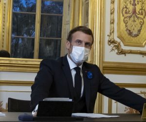 epa08811935 French President Emmanual Macron speaks on the telephone to congratulate US President-elect Joe Biden, at the Elysee Palace in Paris, France, 10 November 2020.  EPA/IAN LANGSDON / POOL
