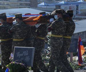 epa08817391 Armenian soldiers carry coffins with bodies of killed soldiers during war in the Nagorno-Karabakh Republic in Yerablur Military Memorial Cemetery in Yerevan, Armenia, 12 November 2020 (Issued 13 November 2020). On 09 November Azerbaijan President Aliyev, Armenian Prime Minister Pashinyan and Russian President Putin signed a statement announcing a complete ceasefire and all military operations in the Nagorno-Karabakh conflict zone from 00:00 a.m. Moscow time on 10 November 2020. Armed clashes erupted on 27 September 2020 in the simmering territorial conflict between Azerbaijan and Armenia over the Nagorno-Karabakh territory along the contact line of the self-proclaimed Nagorno-Karabakh Republic (also known as Artsakh).  EPA/LUSI SARGSYAN / PHOTOLURE PICTURE MADE AVAILABLE TODAY
