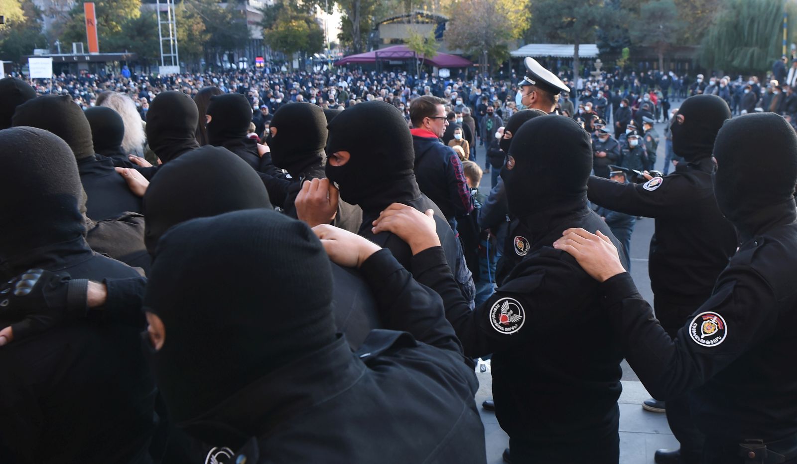 epa08818143 Armenian police officers during an opposition rally in the Freedom Square in Yerevan, Armenia, 13 November 2020. Protesters  demand the resignation of Armenian Prime Minister Nikol Pashinyan and his government. The unrest  and protest erupted in Yerevan on 10 November 2020 after Armenian Prime Minister and Presidents of Azerbaijan and Russia signed a trilateral statement announcing the halt of ceasefire and all military operations in the Nagorno-Karabakh conflict zone.  EPA/LUSI SARGSYAN /PHOTOLURE MANDATORY CREDIT