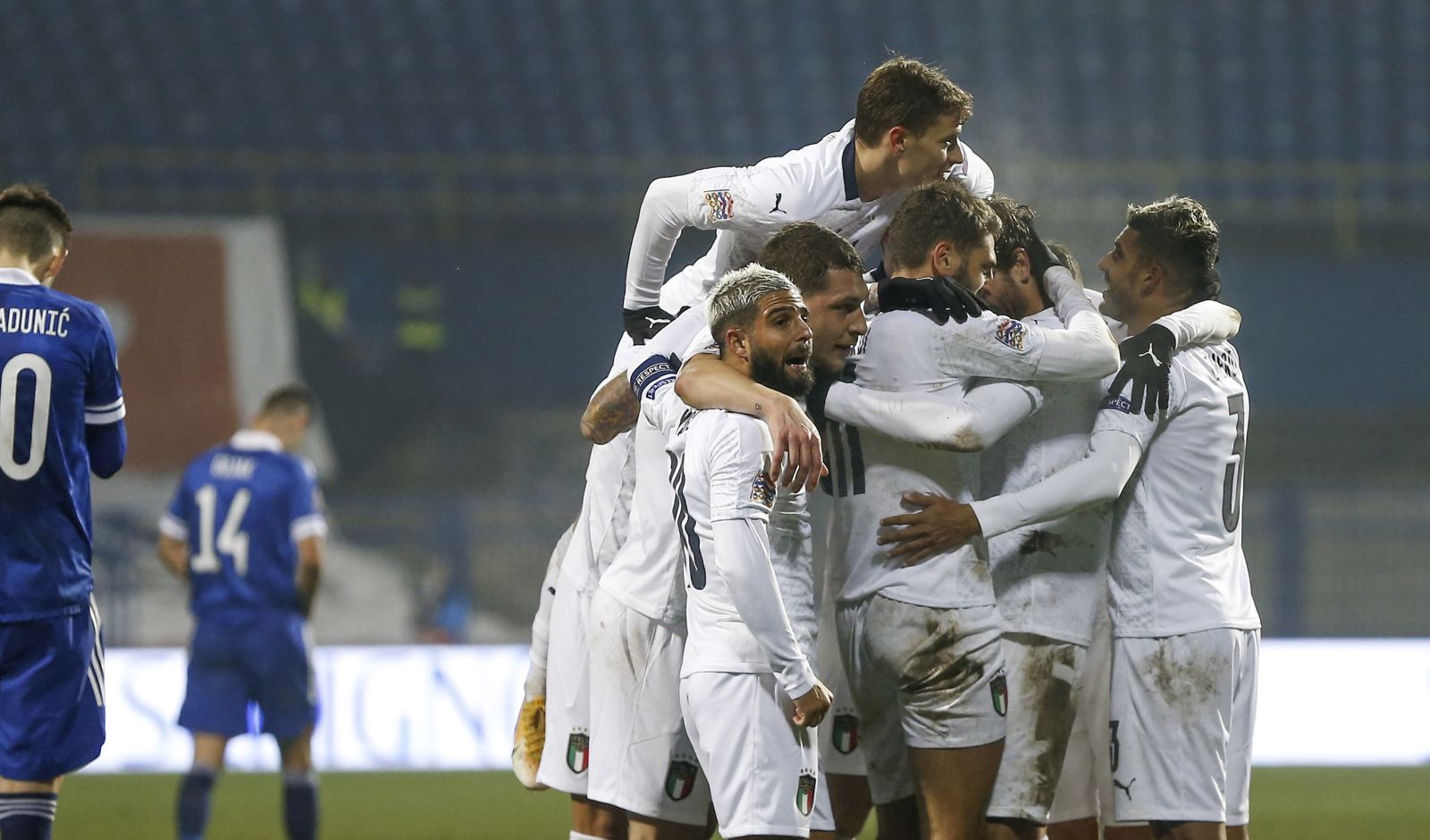 epa08828294 Players of Italy celebrate after scoring the 2-0 during the UEFA Nations League, League A, group 1 soccer match, between Bosnia and Herzegovina and Italy in Sarajevo, Bosnia and Herzegovina, 18 November 2020.  EPA/FEHIM DEMIR