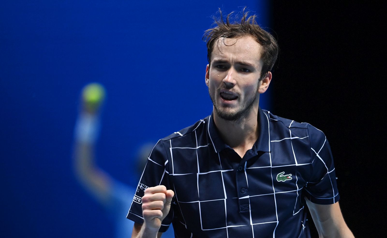 epa08828286 Russia's Daniil Medvedev reacts after winning a crucial point against Serbia's Novak Djokovic during a Nitto ATP finals tennis match at the O2 Arena in London, Britain, 18 November 2020.  EPA/ANDY RAIN