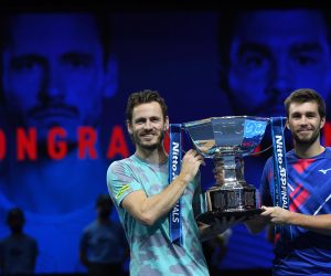 epa08836245 Wesley Koolhof (L) of the Netherlands and Nikola Mektic (R) of Croatia celebrate with the trophy after winning their doubles final match against Austria's Jurgen Melzer and France's Edouard Roger-Vasselin at the ATP World Tour Finals tennis tournament in London, Britain, 22 November 2020.  EPA/ANDY RAIN