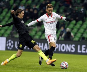 epa08839567 Kristoffer Olsson of Krasnodar (L) in action against Ivan Rakitic of Sevilla during the UEFA Champions League group E soccer match between FC Krasnodar and Sevilla FC in Krasnodar, Russia, 24 November 2020.  EPA/Yuri Kochetkov